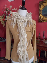 A winter white and gold scarf.